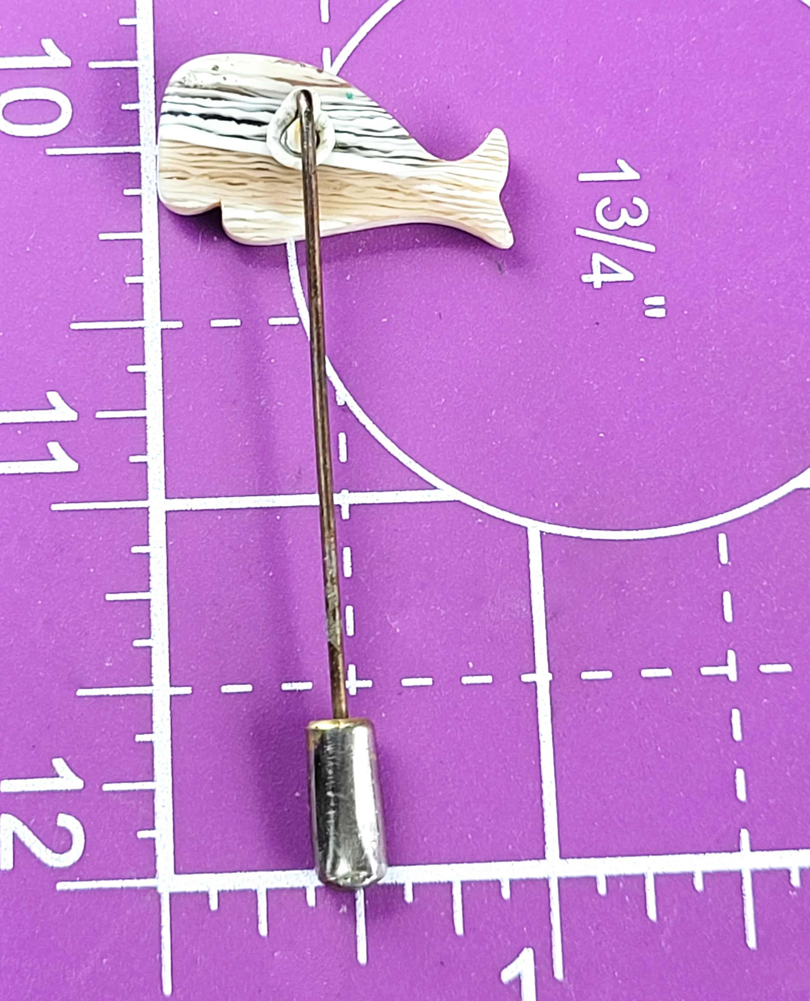 Banded whale vintage warm toned plastic stick lapel pin