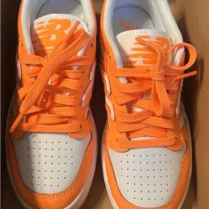 New Balance Orange and White Sneakers